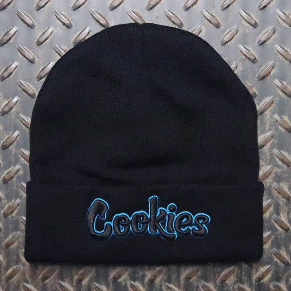 A black knit beanie with the word 'Cookies' embroidered in blue and black on the front cuff, laid flat on a textured diamond plate background. Cookies Original Logo Outline Knit Beanie Back Blue CM253XKB04