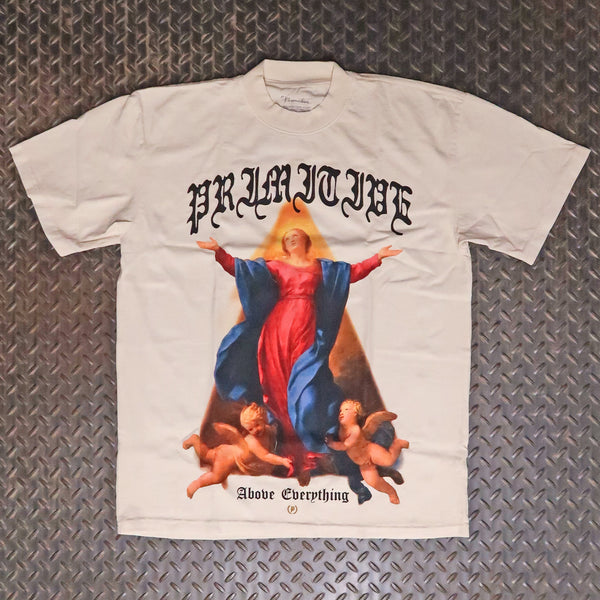 A cream short-sleeve graphic t-shirt featuring a large print of the Virgin Mary with outstretched arms, surrounded by cherubs, with the text 'PRIMITIVE' above and 'Above Everything' below, laid flat on a textured gray diamond plate background. Primitive Prosper Heavyweight T-Shirt Cream PAPSP2609